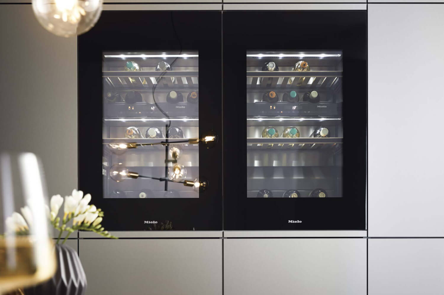 Miele wine fridges in handleless cupboards