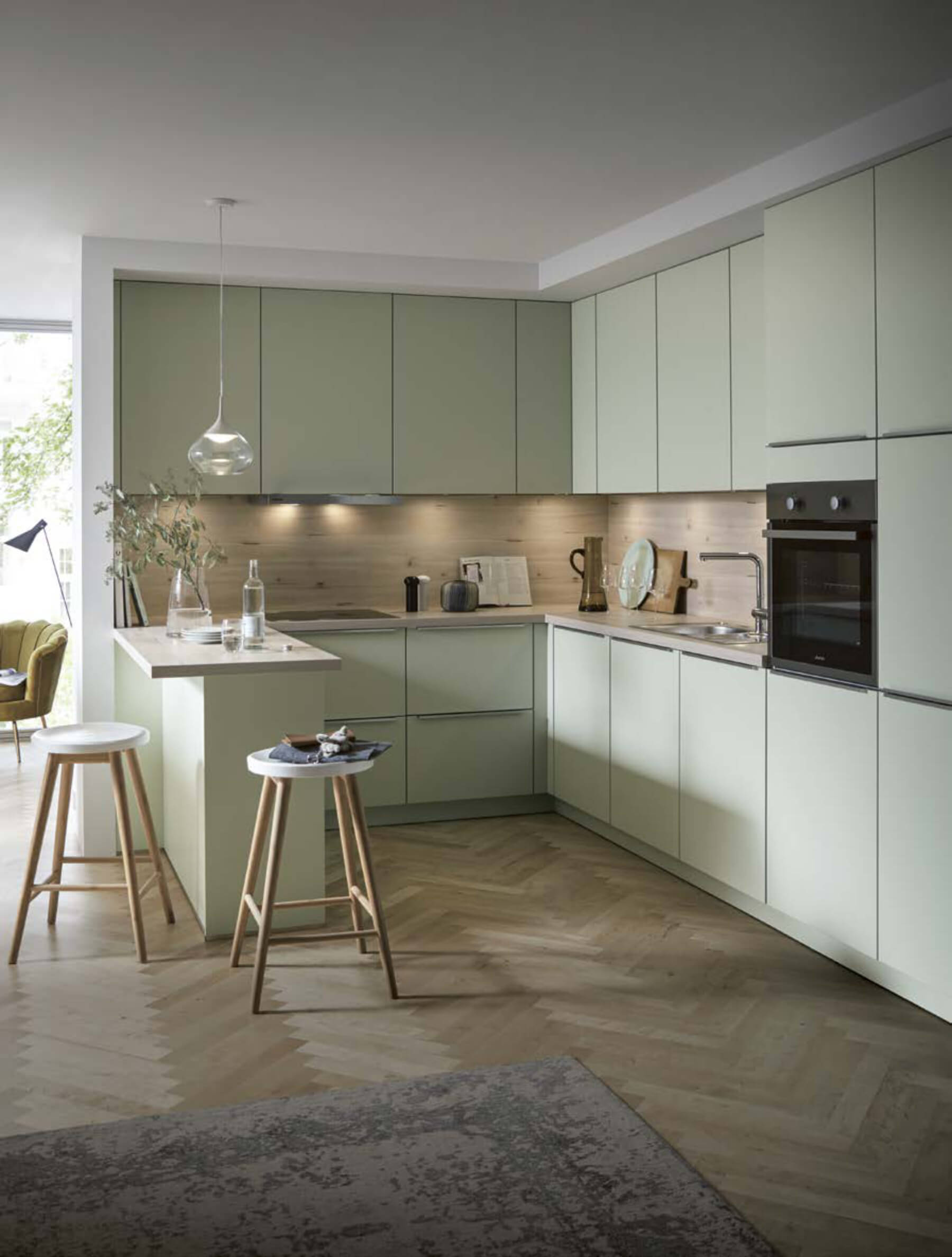 Pastel green satin lacquer peninsula kitchen